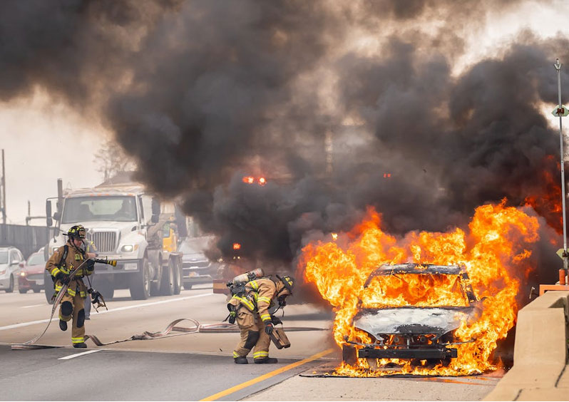 Firefighters putting out a New Orleans Motor Vehicle Fire